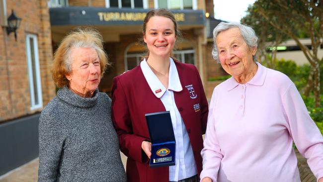 Turramurra House residents Barbara and Ursel with Rosie Spurr of North Turramurra, who won the Lion's award for her volunteer work with aged care centre residents. Photo: Phillip Rogers