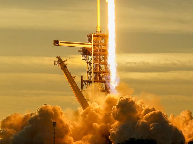 A trail of fire is seen after the SpaceX Falcon 9 rocket and Dragon spacecraft launched from the Kennedy Space Center in Cape Canaveral, Florida. Picture: Brandon Bell/Getty Images/AFP