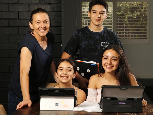 Anna Antonini with Franki, 11, Massi, 14, and Lola, 16, at their New Farm home. Picture: Josh Woning/AAP