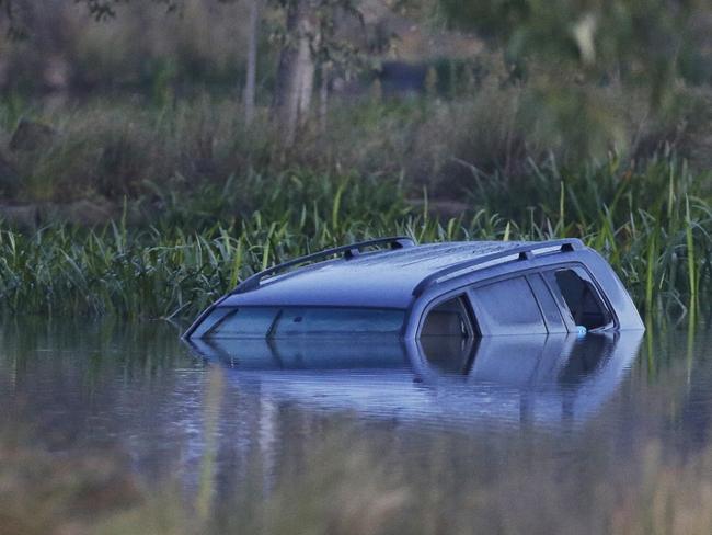 The scene where yesterday a car drove into a lake killing three children on Thursday, April 9, 2015, in Wyndham Vale, Australia. Picture: Hamish Blair