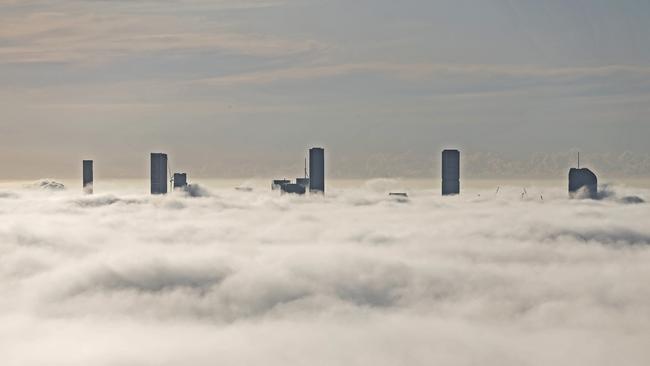 Brisbane City covered in fog, seen from the Mt Coot-Tha Summit Lookout. Picture: Zak Simmonds