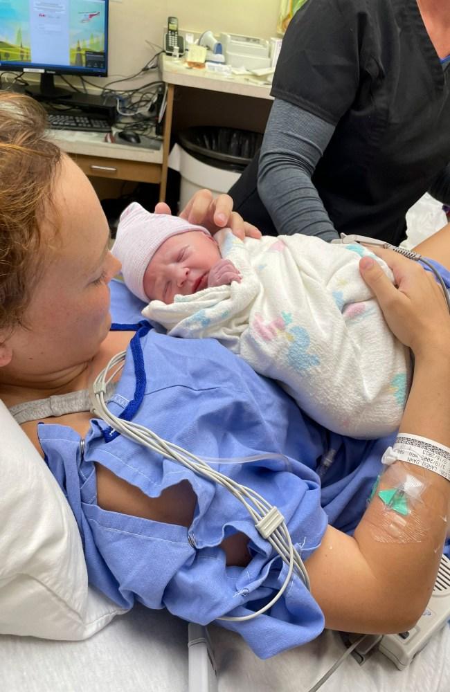 Laren holds her baby shortly after giving birth. Picture: Laren Nelson / CATERS NEWS 