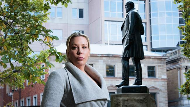 Tasmanian Aboriginal activist with the contentious statue of one time Tasmanian Premier William Crowther. Picture: Peter Mathew