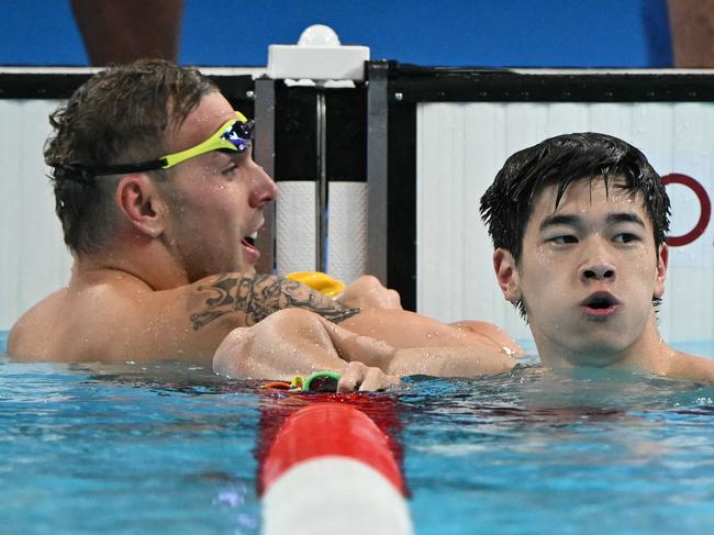 China's Pan Zhanle is congratulated by Aussie Kyle Chalmers after a historic 100m freestyle swim in Paris. Picture: AFP