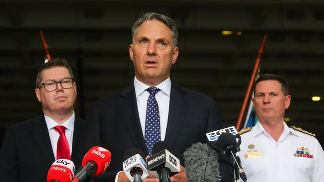 Richard Marles and the Minister for Defence Industry, Pat Conroy, with the Chief of Navy, Vice Admiral Mark Hammond, at the press conference for the government’s policy at Fleet Base East in Sydney this week. Picture: NCA NewsWire / Gaye Gerard