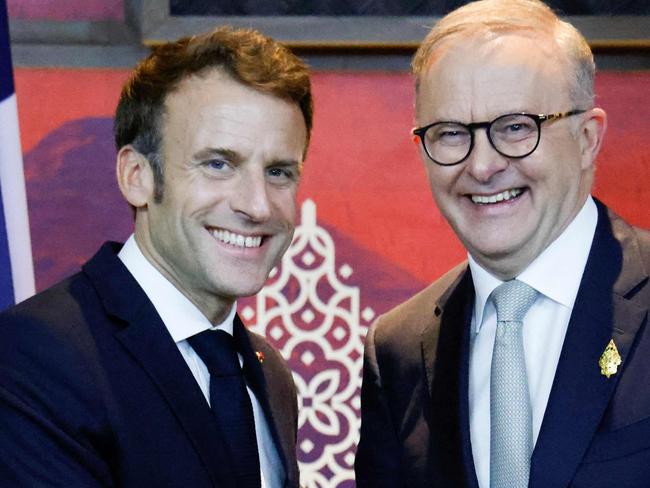 France's President Emmanuel Macron (L) meets Australia's Prime Minister Anthony Albanese on the sidelines of the G20 Summit in Nusa Dua on the Indonesian resort island of Bali on November 16, 2022. (Photo by Ludovic MARIN / POOL / AFP)