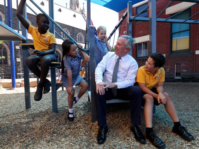 06/02/2018 Catholic Education boss Stephen Elder with students Chol Deng, Mia Phu, Sunnie Barr and  Pietro Gottoli   at St John's Primary School in Clifton Hill, Melbourne. Picture David Geraghty / The Australian.