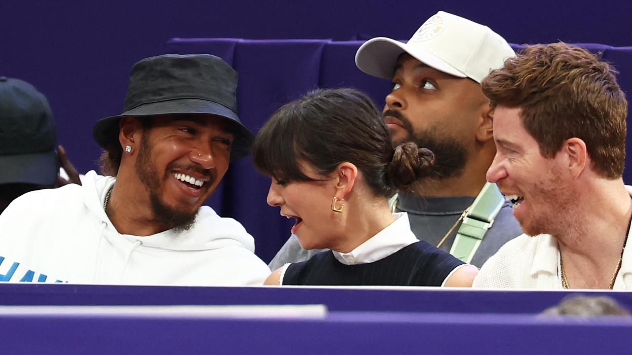 F1 driver Lewis Hamilton with model Nina Dobrev and her partner, former US snowboarder and skateboarder Shaun White at the fencing. Picture: AFP