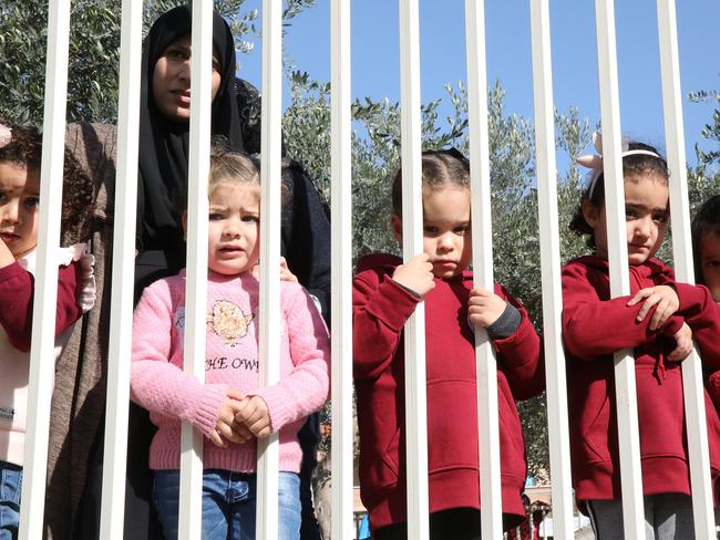 Children line the road during the funeral of Aiia Maasarwe. Picture: Ella Pellegrini