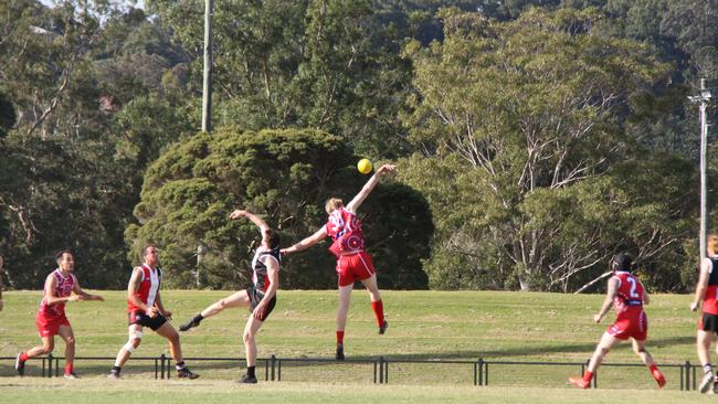 FLYING HIGH: Lismore Swans player soared above Sawtell Toormina Devils during the Sir Doug Nicholls Round on May 29, 2021. Photo: Alison Paterson