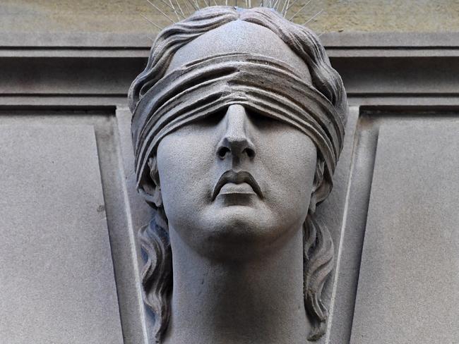 Statue of Lady Justice is seen on Central Local Court  in Sydney, Wednesday, July 5, 2017.  (AAP Image/Keri Megelus) NO ARCHIVING