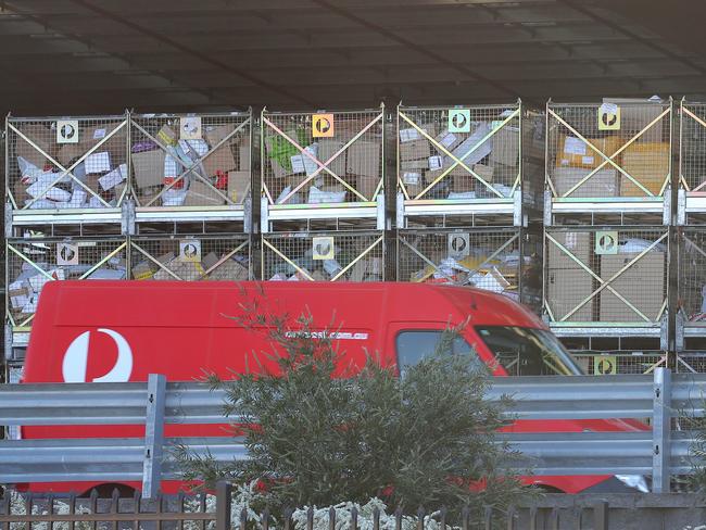 The Australia Post bulk parcels distribution centre at Chullora is inundated with packages during the Covid 19 lockdown with drivers struggling to keep up with all the online shopping that has increased due to shops and retail outlets being closed. Picture: Toby Zerna