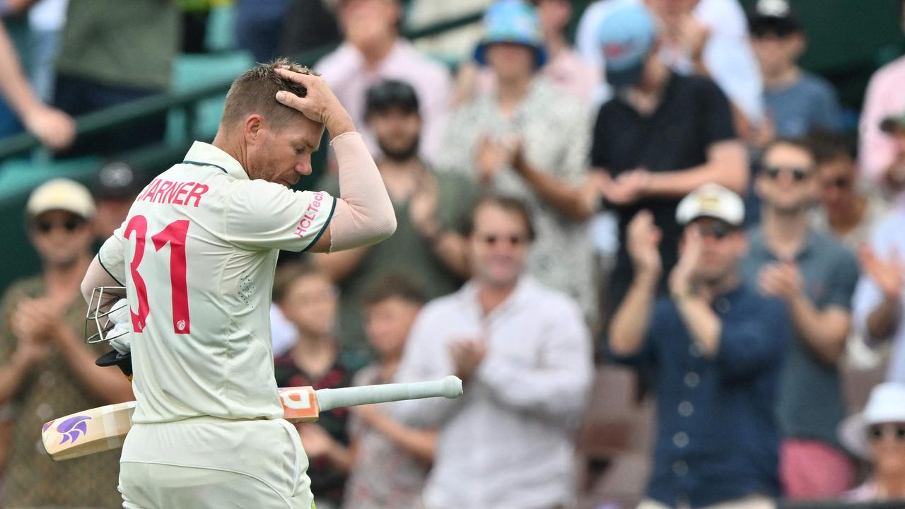 Australia's David Warner walks off the field after his dismissal.