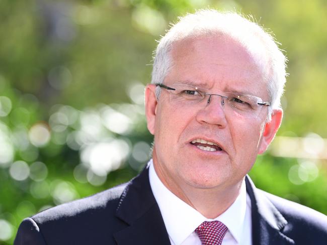 Australian Prime Minister Scott Morrison looks on during a press conference in the carpark of Esida Lodge Aged Care in Brisbane, Thursday, January 31, 2019.  Morrison relocated the  press conference to the facility due to Labor protestors at a prior site. (AAP Image/Dave Hunt) NO ARCHIVING