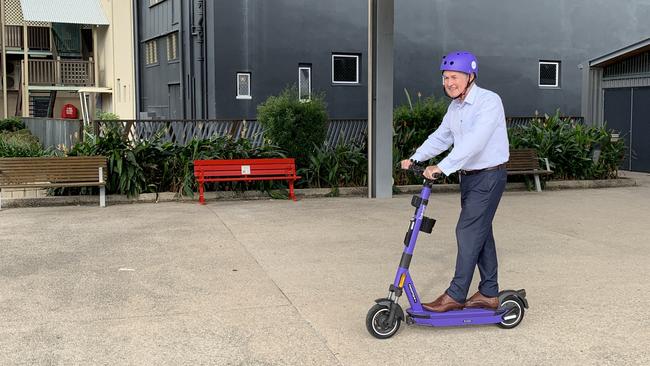 Mackay Mayor Greg Williamson goes for a breezy spin at Bluewater Quay on the Beam e-scooter. Picture: Duncan Evans