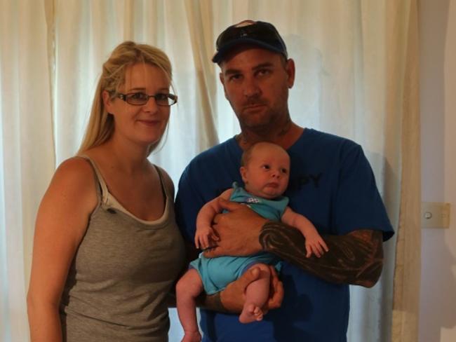 Samantha Handley and Darren James Brown with their son.