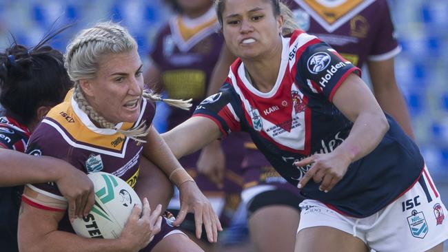 Ali Brigginshaw of the Broncos is tackled during the NRL Women's Premiership Grand Final between the Brisbane Broncos and the Sydney Roosters at ANZ Stadium in Sydney, Sunday, September 30, 2018. (AAP Image/Craig Golding) NO ARCHIVING, EDITORIAL USE ONLY