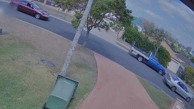 The maroon Ford Falcon and silver Holden Commodore.