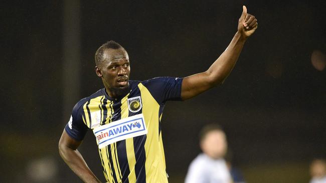 Usain Bolt acknowledges the crowd as he celebrates scoring his second goal for the Central Coast Mariners on Friday night. Picture: AFP