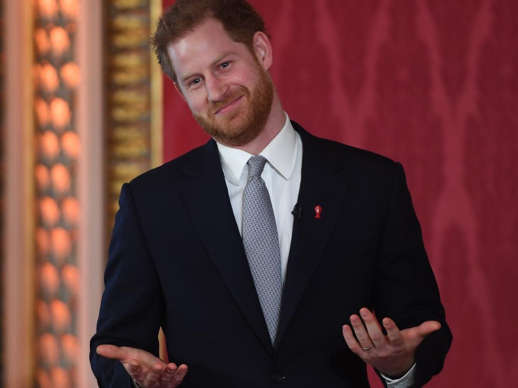 Harry gestures during the draw. Picture: Jeremy Selwyn/AFP