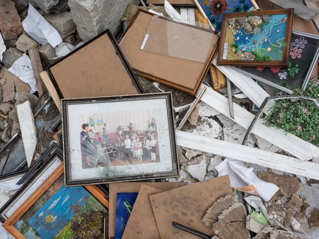 A damaged photo frame with a photo of kids performing is seen outside of a kindergarten that was bombed during the Russian invasion west of Kyiv in Makariv, Ukraine. Picture: Getty Images