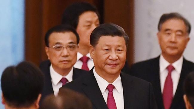 President Xi Jinping arrives with Premier Li Keqiang, left, for a reception at the Great Hall of the People on the eve of China's National Day in September. Picture: AFP