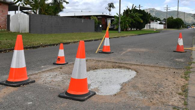 Work has begun on sinkholes which opened up in the centre of the road. Residents estimate “about ten” holes popped up after the March rainfall in Aitkenvale. Picture: Evan Morgan