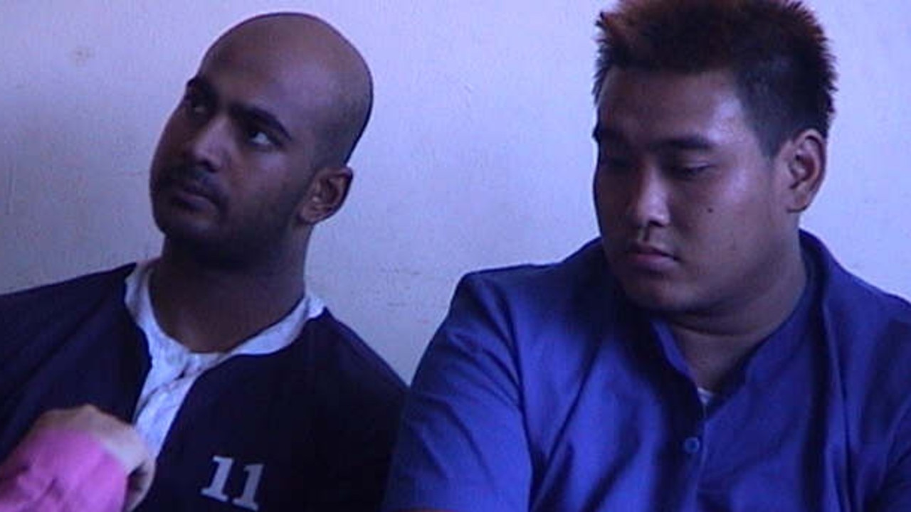 Myuran Sukumaran, 24, and Tan Duc Thanh Nguyen, 27, at Denpasar Police headquarters in Bali following their arrest.