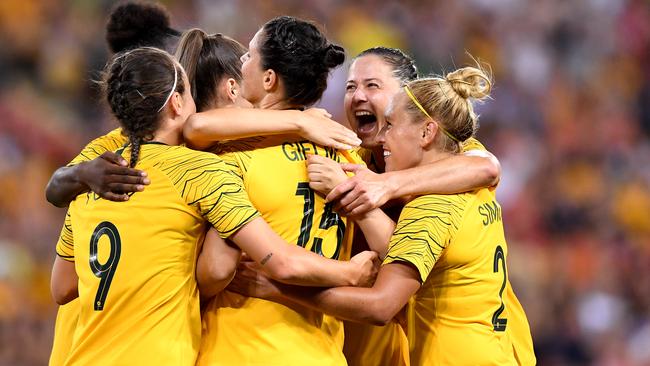 Emily Gielnik is mobbed by teammates after scoring the Matildas’ fourth goal against South Korea. Picture: Getty Images