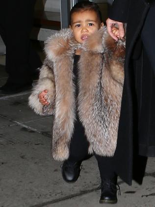 Kim Kardashian and Kanye West attacked for dressing North in a fur coat