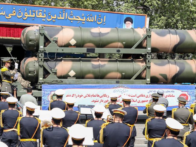 An Iranian military truck carries parts of a S-300 air defence missile system during a military parade as part of a ceremony marking the country's annual army day in the capital Tehran on April 17, 2024. (Photo by ATTA KENARE / AFP)