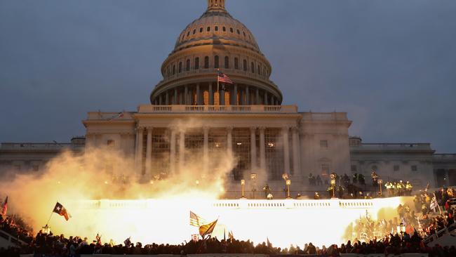 A police munition explodes in front of the US Capitol Building in Washington on Thursday. Picture: Reuters