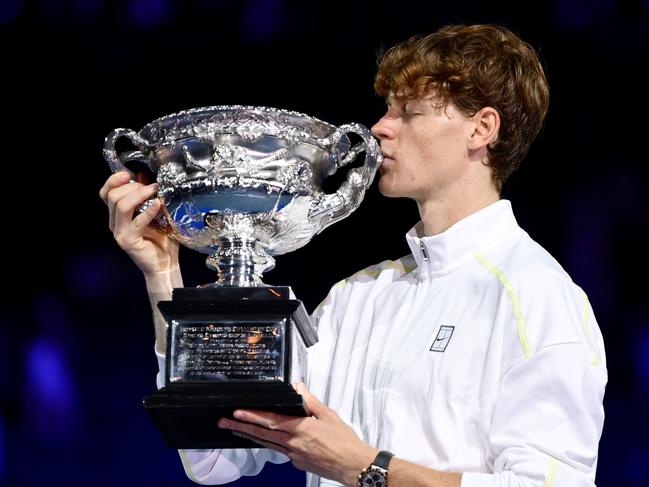 MELBOURNE, AUSTRALIA - JANUARY 26: Jannik Sinner of Italy  kisses the Norman Brookes Challenge Cup at the Men's Singles trophy presentation following the Men's Singles final against Alexander Zverev of Germany during day 15 of the 2025 Australian Open at Melbourne Park on January 26, 2025 in Melbourne, Australia. (Photo by Quinn Rooney/Getty Images) *** BESTPIX ***