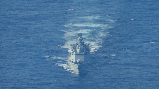 SCARBOROUGH SHOAL, SOUTH CHINA SEA - FEBRUARY 18: A Chinese Navy warship sails near the waters of Scarborough Shoal, as seen from aboard a Philippine Bureau of Fisheries and Aquatic Resources plane on February 18, 2025 in the South China Sea. A Chinese Navy helicopter nearly collided with a Philippine Bureau of Fisheries and Aquatic Resources plane in the latest flare-up of tensions between the two countries in the disputed waters. The incident occurred when the Chinese Navy deployed a helicopter to tail the Philippine civilian plane, which was conducting a routine maritime domain awareness flight over Scarborough Shoal, located within the Philippines' exclusive economic zone. (Photo by Ezra Acayan/Getty Images)