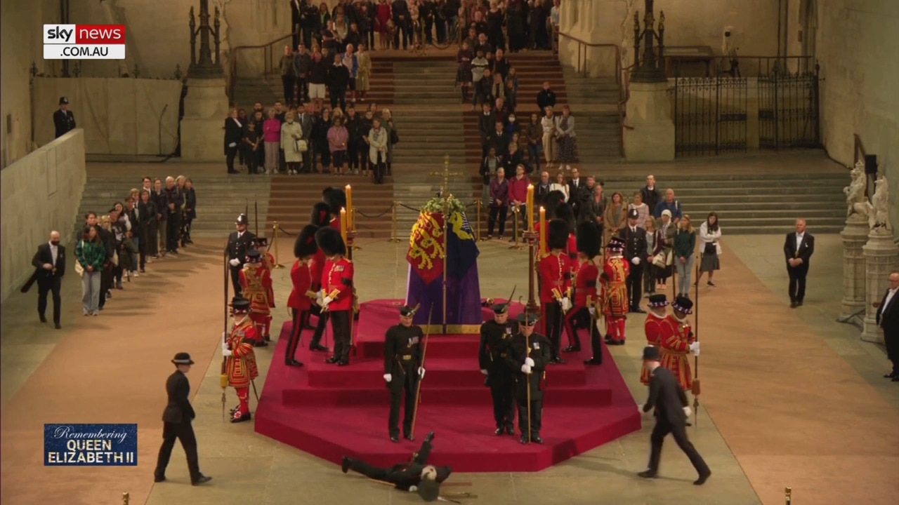 Queen’s guard collapses in front of her coffin