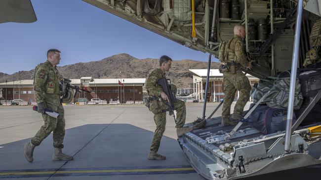 Diggers board an RAAF C130 aircraft at the Hamid Karzai International Airport in Kabul on June 18. Picture: Gary Ramage