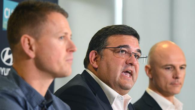 Brendon Bolton, Carlton President Mark LoGiudice and CEO Cain Liddle front the media on Monday.