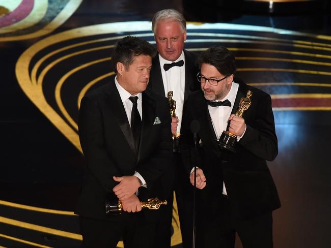 Best Sound Mixing recipients Paul Massey, Tim Cavagin and John Casali. Picture: AFP 