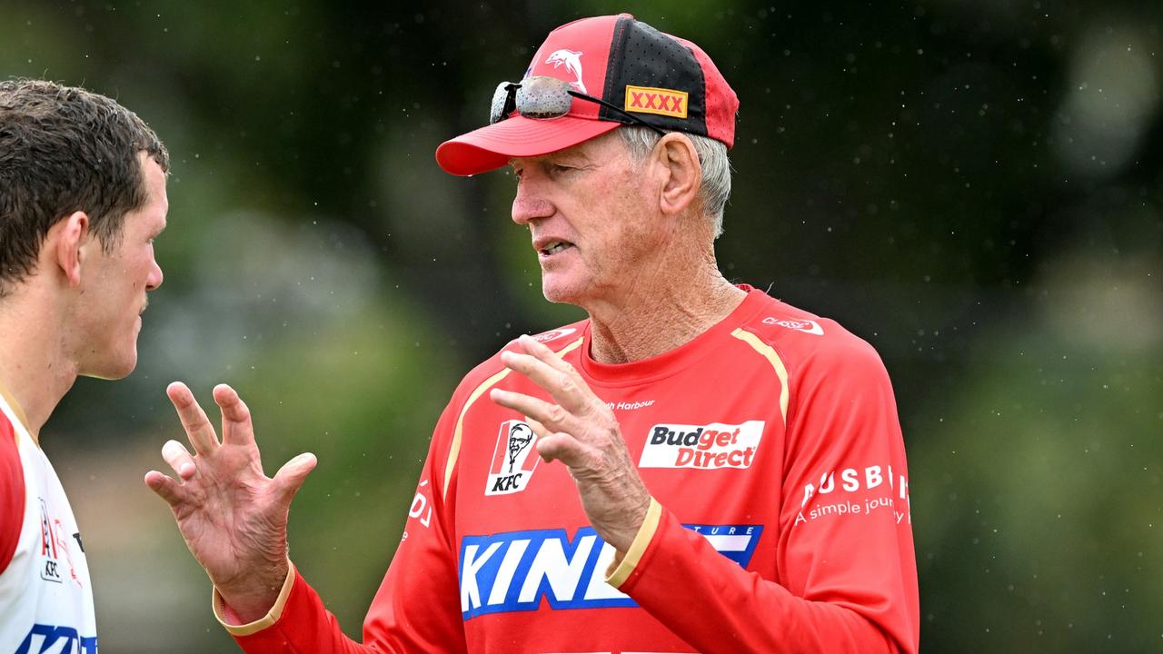 BRISBANE, AUSTRALIA - JANUARY 24: Coach Wayne Bennett chats with Tom Gilbert during a Dolphins NRL training session at Kayo Stadium on January 24, 2023 in Brisbane, Australia. (Photo by Bradley Kanaris/Getty Images)