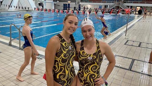 Emma Hutchings, left, with a teammate. The elite high jumper from St Ritas was third to Hannah Casey and Elna Staal