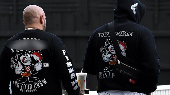 Men wearing Finks insignia bikie jumpers at the scene of the Frankston shooting. Picture: Nicole Garmston