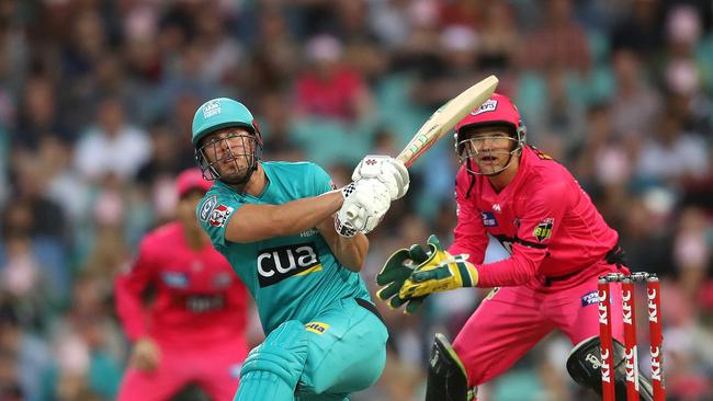 Heat's Chris Lynn smashes a six during the Big Bash match between the Sydney Sixers and Brisbane Heat at the SCG. Picture. Phil Hillyard