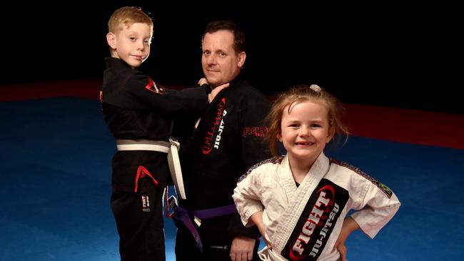 Fight Club Townsville instructor Eric Lemoine with Quade Powers, 8, and Isabelle MacLean, 6. Picture: Evan Morgan