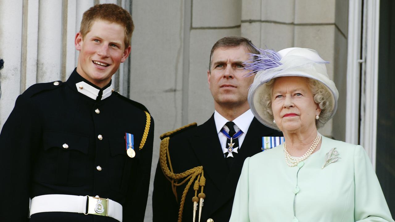 Prince Harry and Prince Andrew, both in military wear, alongside the Queen in 2005. Picture: Anwar Hussein/Getty Images