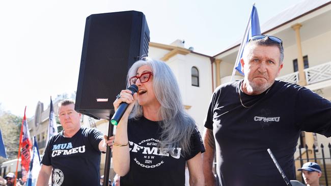 Rita Mallia and Darren Greenfield address f striking workers at a CFMEU protest rally outside parliament. Picture by Max Mason-Hubers