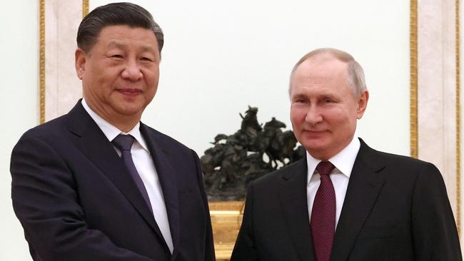 Russian President Vladimir Putin meets with China's President Xi Jinping at the Kremlin in Moscow.