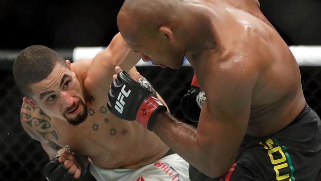 Robert Whittaker battles Jacare Souza.