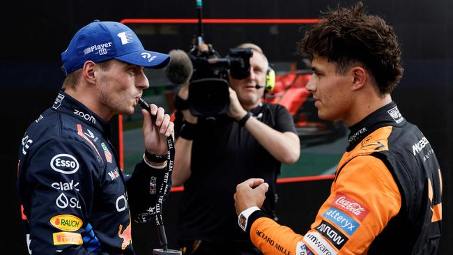 Norris (right) is ready to take the fight up to Verstappen. (Photo by SIMON WOHLFAHRT / AFP)