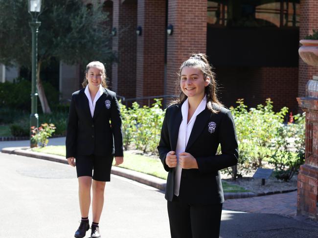 Olivia Ayoub, year ten and Sienna Serna, year seven, pose for a photograph at Santa Sabina School. Picture: Craig Wilson