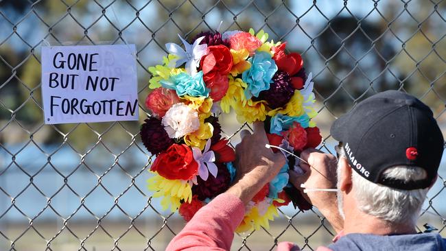 Last day of the Hazelwood power station in Morwell. A worker lays a wreath. Picture: Jason Edwards